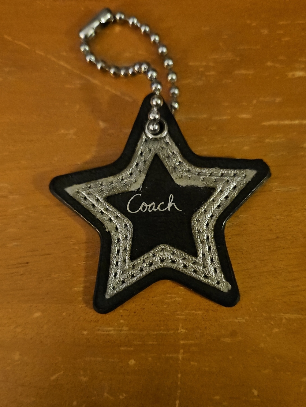 Coach Black Star Keychain with Silver Stitching